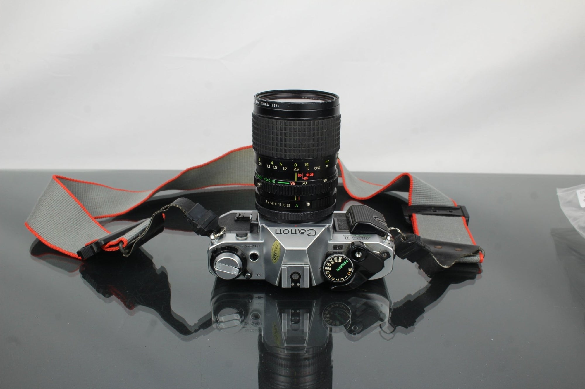 Canon AE - 1 Program + Tokina AT - X 28 - 85mm Canon FD mount lens - Dutch|Thrift